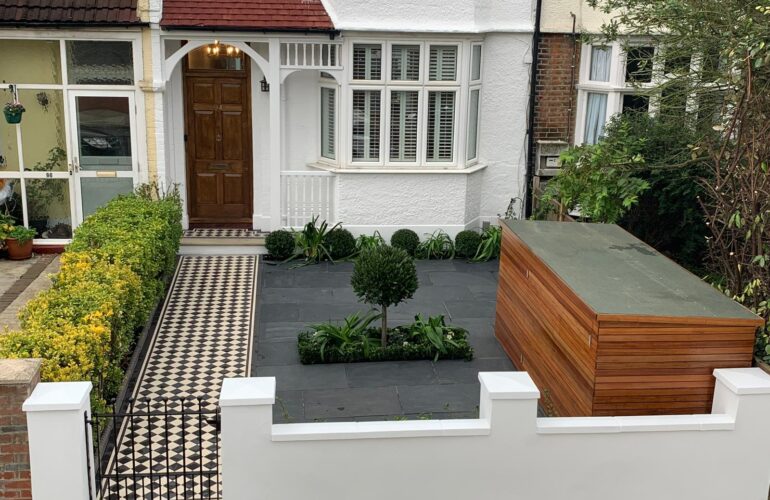 front garden with green tree and masked storage container